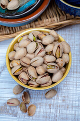 Roasted salty pistachio nuts, tasty healthy vegetarian snack food
