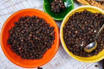 Indian spices collection, dried black peppercorns, kitchen spices