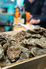 Catch of the day for sale on daily fish market, fresh oysters, Cancale, Brittany, France