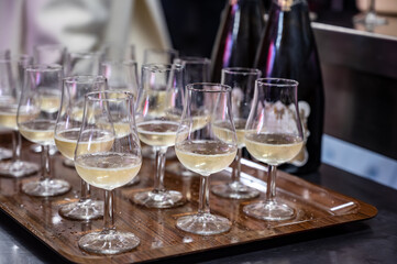 Many small tasting glasses of sparkling wine champagne on winter festival in December, Avenue de Champagne, Epernay, Champagne region, France