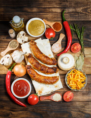 Fried barbecue sausages with vegetables and various spices