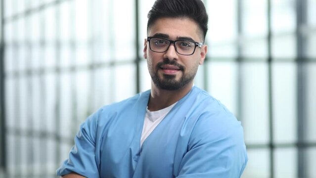 Focused on saving lives. Portrait of young male doctor standing in a hospital