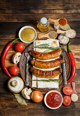 Fried barbecue sausages with vegetables and various spices