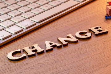 change word or concept made by wooden letters on wooden background