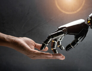 The human hands touch the robot's metallic hand. Concept of harmonious coexistence of humans and AI technology