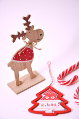 Wooden Santa's reindeer and candy canes standing Christmas home decor 