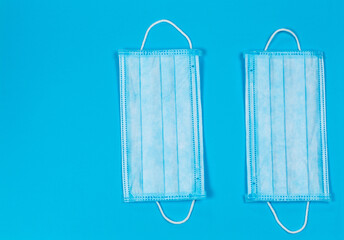 Medical instruments and protective equipment on a blue background