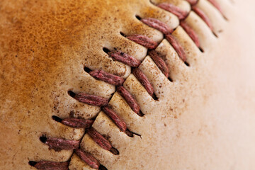 Fototapeta na wymiar Close-Up Shot Of Threads On Old Baseball