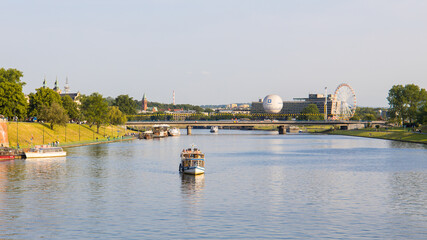 Vistula river in the city centre of Krakow, Poland on a beautiful summer day - obrazy, fototapety, plakaty