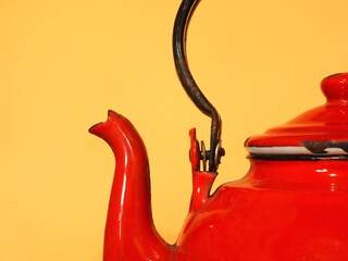 Old retro vintage red tea pot closeup