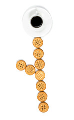 Round chocolate and vanilla cookies with a cup in front of a white background