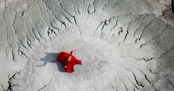 Semazen (dervish) is dancing in the traditional red dress. Whirling dervish in red traditional dress is spinning in awe.