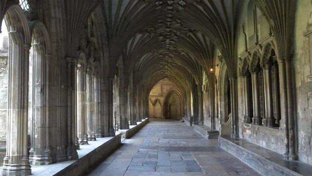 POV: Beautiful cloister with gothic arches in magnificent Canterbury Cathedral. Stunning architectural details of a religious and pilgrimage building in England, which is under UNESCO protection.