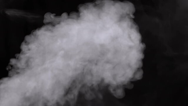 Stream of Swirling White Smoke, Steam on an Empty Background. Black background. Texture. Abstract. Flash. Passing stream smoke, vapor. Exploding whirlpool of particles of gas. Trail. Blurred motion.