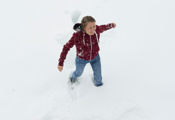 girl playing with snow