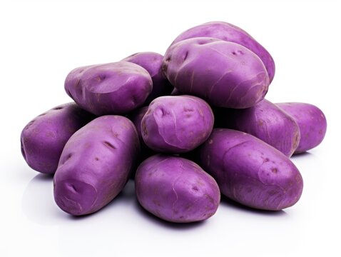 A pile of purple potatoes on a white surface.