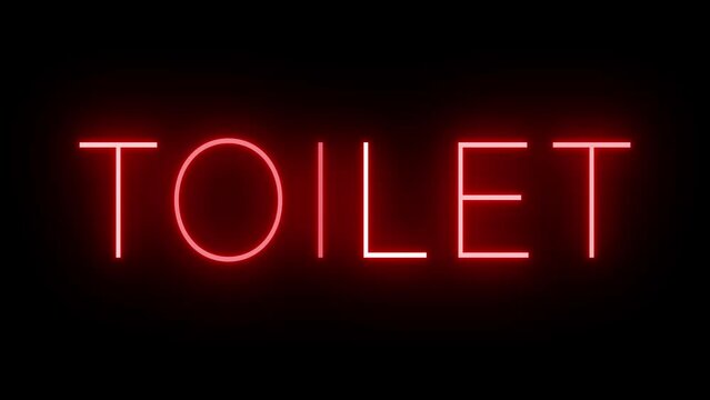 Flickering red retro style neon sign glowing against a black background for TOILET