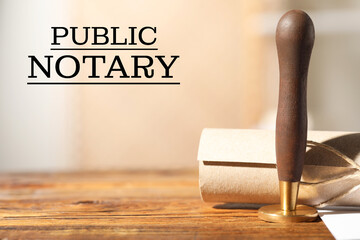 Public notary. Document and stamp on wooden table, space for text - obrazy, fototapety, plakaty