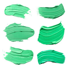 Light green oil paint strokes isolated on white, top view