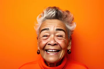 Poster Portrait of laughing senior woman looking at camera. © Maria