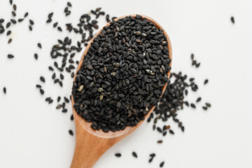 Black Sesame Seeds in Wooden Spoon