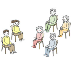 椅子に座っているシニアの男女とスタッフ