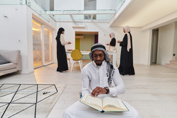 In the sacred month of Ramadan, an African American Muslim man engrossed in reading the Holy Quran...