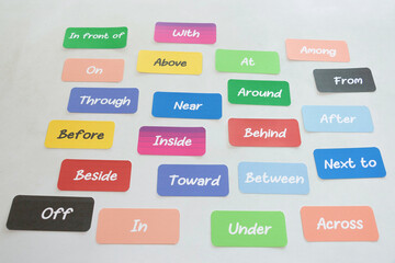 English grammar word cards on white desk