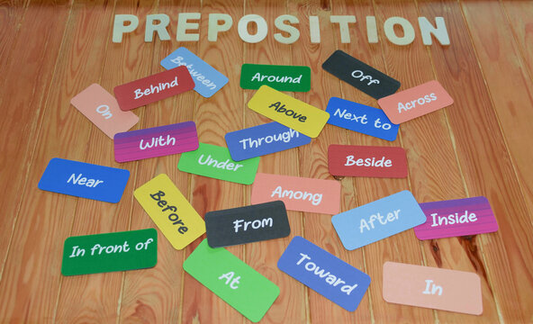 English grammar word cards on wooden desk