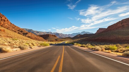 Fototapeta na wymiar Road Winding along empty roads through a barren desert landscape.