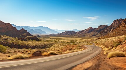 Fototapeta premium Road Winding along empty roads through a barren desert landscape.