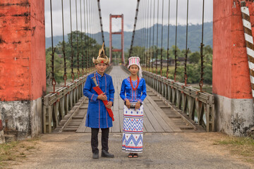 young couple of Rawang people in traditional Rawang dress at Kaungmulone Bridge across Mali Kha...