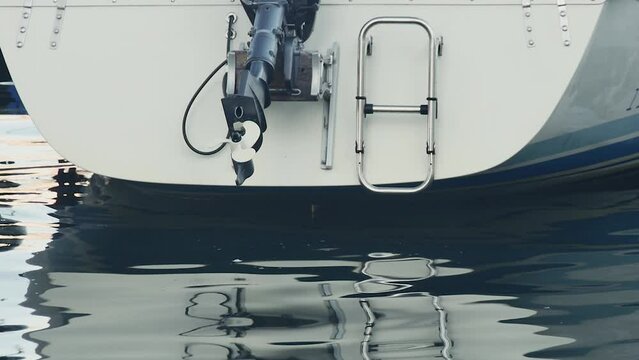 bottom view of the back of a boat with outboard motor