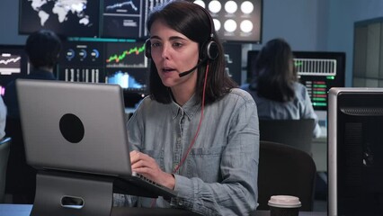 Zoom in video of young woman talking to a costumer in service call. 4k resolution hand held video. Business.