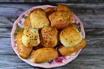 Pile of mini Pâté with different fillings and toppings, cheese, olive, topped with sesame, black...