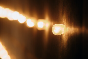 Light in the dark, abstract background with bokeh effect.
