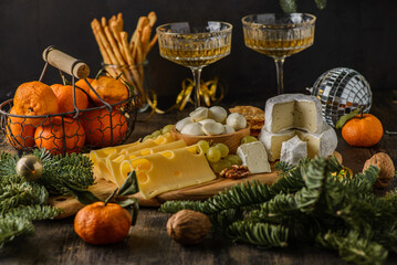 slicing brie mozzarella and maasdam cheeses with champagne