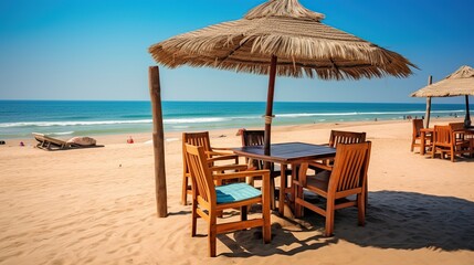 chairs for relaxing and sunbathing with umbrellas beside sea beach