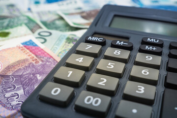 Close up on a Calculator accounting concept Polish zloty banknote background currency