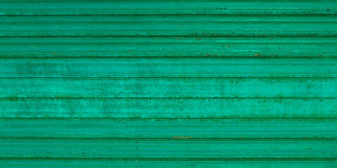 Green light wall old metal roller door background texture vintage warehouse entrance