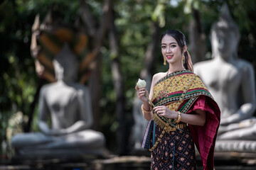  women in traditional clothing  on Buddhist on background.  Portrait women in traditional clothing...