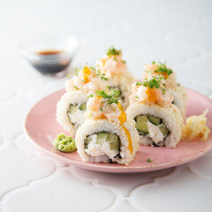 Shrimp sushi rolls with mango sauce