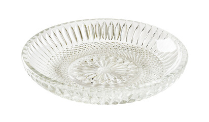 Empty cut glass saucer cutout. Beautiful vintage glass dessert plate isolated on a white background. Glass tableware for food design. Modern crockery concept.