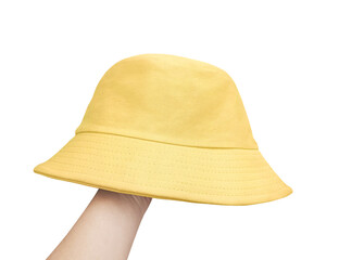 Hand covered with yellow bucket hat white background