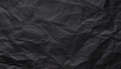 A black crumpled paper background. - obrazy, fototapety, plakaty