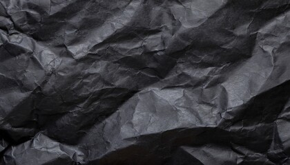 A black crumpled paper background.