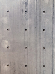 Gray cement wall with rivets - vintage texture, background