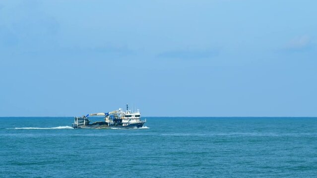Fishing Vessel Sailing On Waves In Sea To Fish. Sea Summer Ocean Daylight Nature Background. Real time.