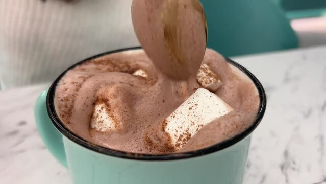 cup with cappuccino coffee. Coffee cortado with thick milk foam. Spin a glass with cortado spanish coffee. Gourmet Hot Chocolate Milk 