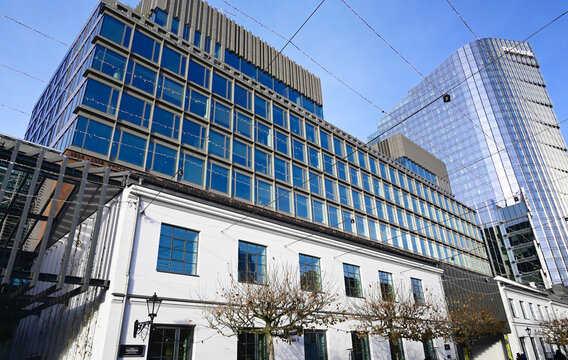 Warsaw, Wola, Poland, Europe - Norblin Factory, post-industrial buildings renovated and transformed into entertainment, food and shopping complex, mBank Tower skyscraper in background right